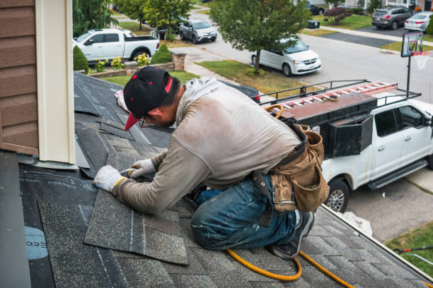 Professional Roofing technician working in Emmett, MI